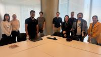 REC scholars pictured in front of table